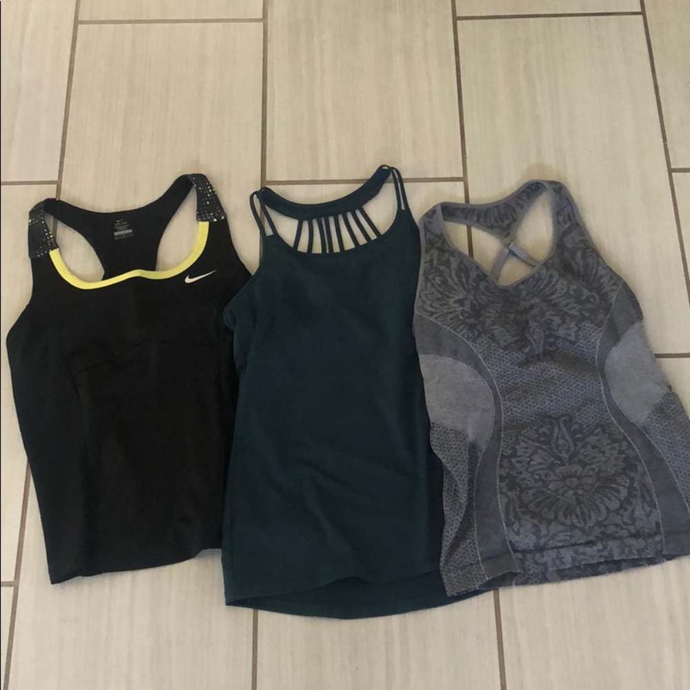 Three size medium workout tanks